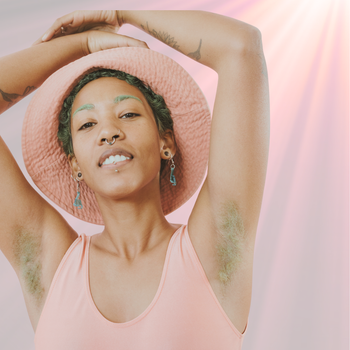 Person with natural axilla hair raising arms confidently