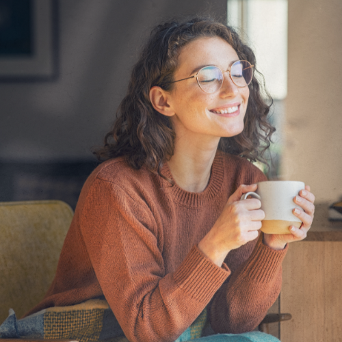 Woman feeling relaxed and confident while managing PCOS facial hair.